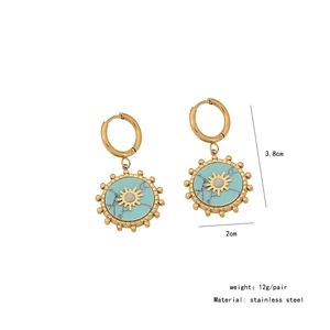 Detail of gold stainless steel earrings with turquoise sun patterns and size specs