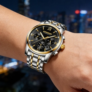 Detailed view of elegant men's stainless steel watch with black dial worn on wrist