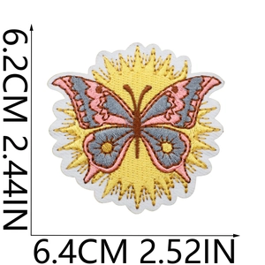 Macro detail of sun and butterfly embroidered patch showing precise 6.4cm x 6.2cm dimensions