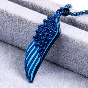 Detailed view of the cobalt blue electroplated wing pendant with textured feathers