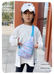 Kid wearing blue crossbody chest bag with unicorn and rainbow patterns in outdoor setting