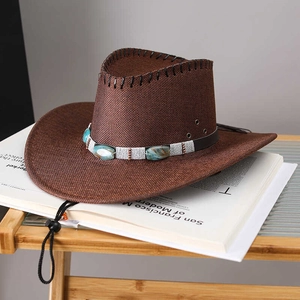 Detail of dark brown western straw hat with decorative faux turquoise leather band
