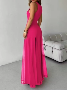 Detail of hot pink sleeveless maxi dress featuring a sheer mesh hem and high side slit
