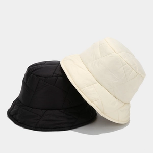 Quilted warm winter bucket hats for women in black and cream beige with geometric texture