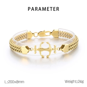 Detail view of gold double-row Cuban link bracelet with anchor charm and size parameters