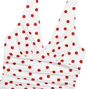 Detail of white V-neck halter dress with red polka dots and pleated chest design