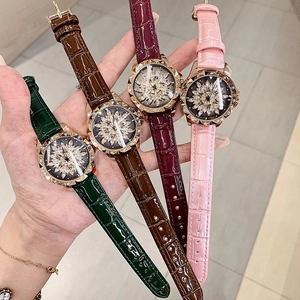 Women's wrist watches featuring rotating floral crystal dials and crocodile leather straps