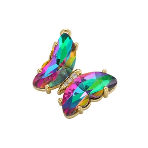 Macro shot of 18K gold plated butterfly pendant with vibrant colorful faceted crystals
