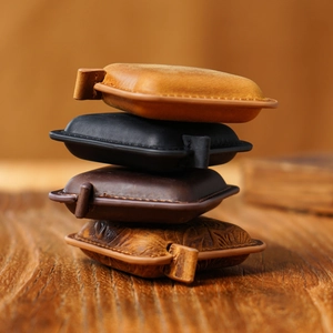 Handmade genuine leather mini tape measure set in vintage cowhide finish on wood