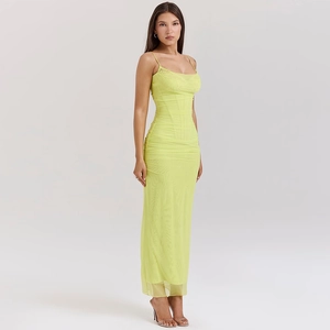 Detail view of the sleek light green mesh dress with thin straps and a slim silhouette