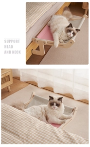 Detail showing solid wood cat window perch with pink fabric supporting pet neck