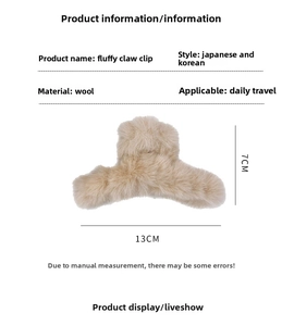 Detail showing plush beige faux fur hair claw clip dimensions measuring 13cm by 7cm