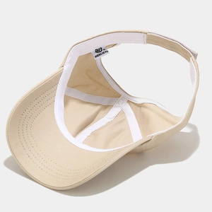 Inside view of khaki ponytail sun visor hat with adjustable velcro strap and sweatband