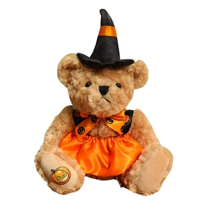 Halloween witch teddy bear plush in black wizard hat and orange dress on white background