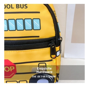 Detail view of smooth metal double zippers on a yellow school bus themed kids sling bag