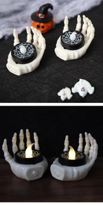 Halloween skeleton hand LED candle lamp with spider web detail in day and night views