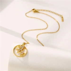 Minimalist 18K gold stainless steel necklace with leaf pendant and sparkling crystals