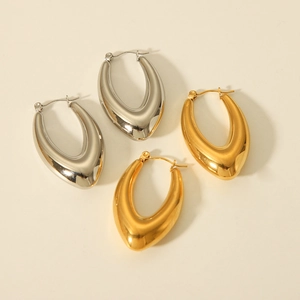Polished gold and silver teardrop hoop earrings showing high-shine metallic finish