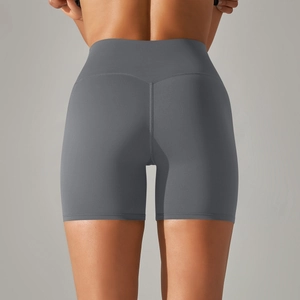 Detail of high-waist charcoal yoga shorts showing matte texture and lifting seams