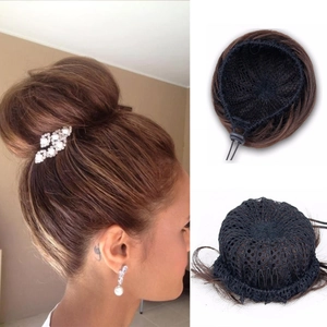 Detail of synthetic hair bun with drawstring net and internal comb in dark brown
