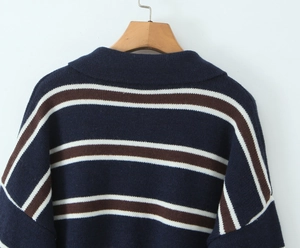 Macro detail of the back view of a navy blue striped knit polo shirt with turn-down collar
