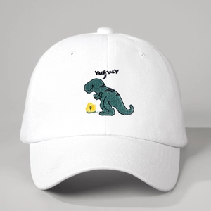 White cotton baseball cap featuring green dinosaur embroidery and adjustable fit