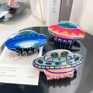 Cartoon UFO alien acrylic hair claws in blue and pink for creative sci-fi hair styling