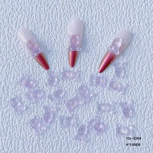 Detailed view of 8x10mm purple resin bear nail charms with golden ombre tips
