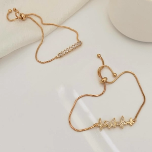 Close-up of golden adjustable butterfly bracelet with zircon inlay and slider clasp mechanism