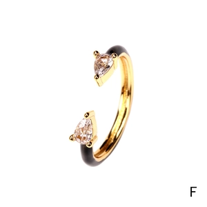 Detail of adjustable open ring with black enamel finish and pear-cut cubic zirconia