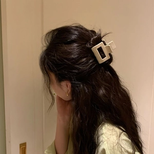 Elegant cream square acetate hair claw clip for women in a stylish half-up hairstyle