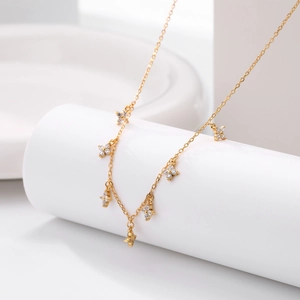 Elegant S925 sterling silver gold necklace featuring cubic zirconia flower pendants