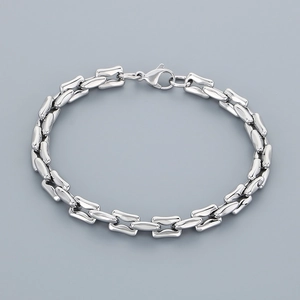 Close-up of titanium steel bracelet featuring polished rectangular links and lobster clasp