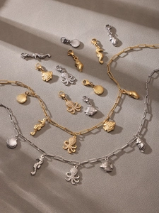 Detail of ocean-themed charms including starfish and seahorses with 5A zircon stones