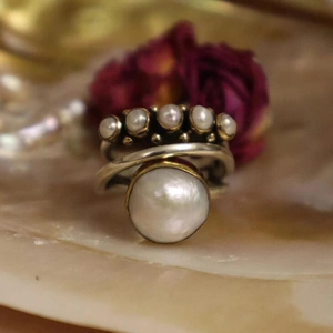 Vintage style silver wrap ring featuring a large pearl and multiple small accent pearls