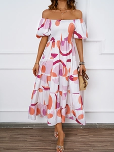 Dettaglio del corpetto a punto smock e gonna a balze con stampa geometrica rosa e arancio