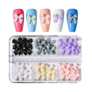6-grid box of 3D resin butterfly nail art charms in multi-colors with sample display