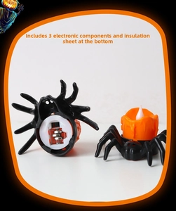Detail view showing black spider LED candle base with 3 button batteries and insulation sheet