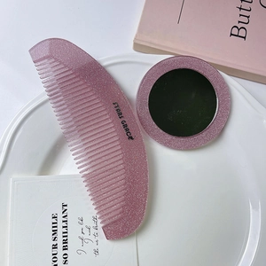 Glitzerndes rosa Haarbürsten und Spiegel Set im Halbmond Design für Styling unterwegs