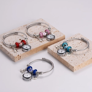 Adjustable stainless steel beaded bracelet watch with swan and heart charms in four colors