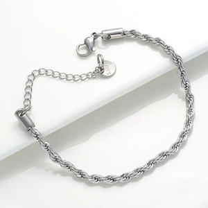 Close-up of 4mm silver twisted rope chain bracelet with lobster clasp and S.steel tag