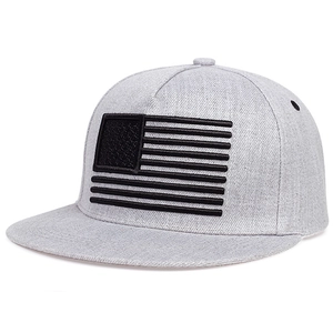Detail of the high-quality black embroidered US flag pattern on a light grey hip hop cap
