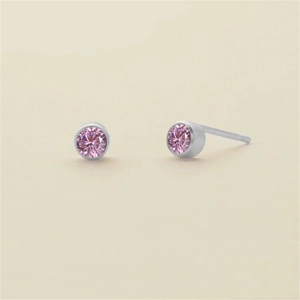 Pink round crystal stud earrings with silver-tone bezel setting and stainless steel pin