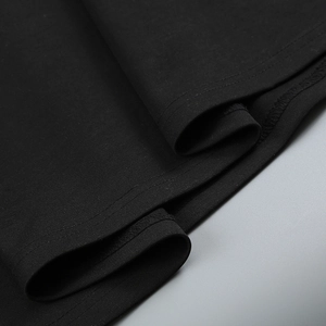 Close-up of high-density black knit fabric showing premium stitching and pleated texture