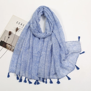 Close-up of blue pattern cotton linen scarf with soft fringe trim and wave textures