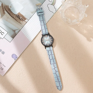 Chic women's quartz watch with light blue leather strap and black round dial