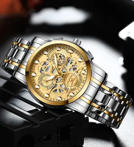 Macro shot of gold and silver steel watch with hollow mechanical dial and WR 500 detail