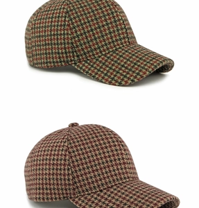 Detail view of retro houndstooth pattern baseball caps in premium wool blend fabric