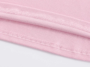 Macro shot of fine pink knit fabric featuring high-quality double-needle stitching detail