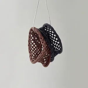 Minimalist elastic braided hair ties in brown and black with hollow mesh knit texture